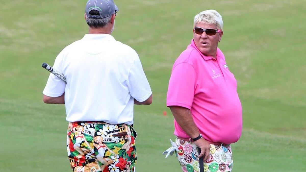 John Daly talks with his caddie during Pro Am at the Mississippi Gulf Resort Classic at Fallen Oak Wednesday.