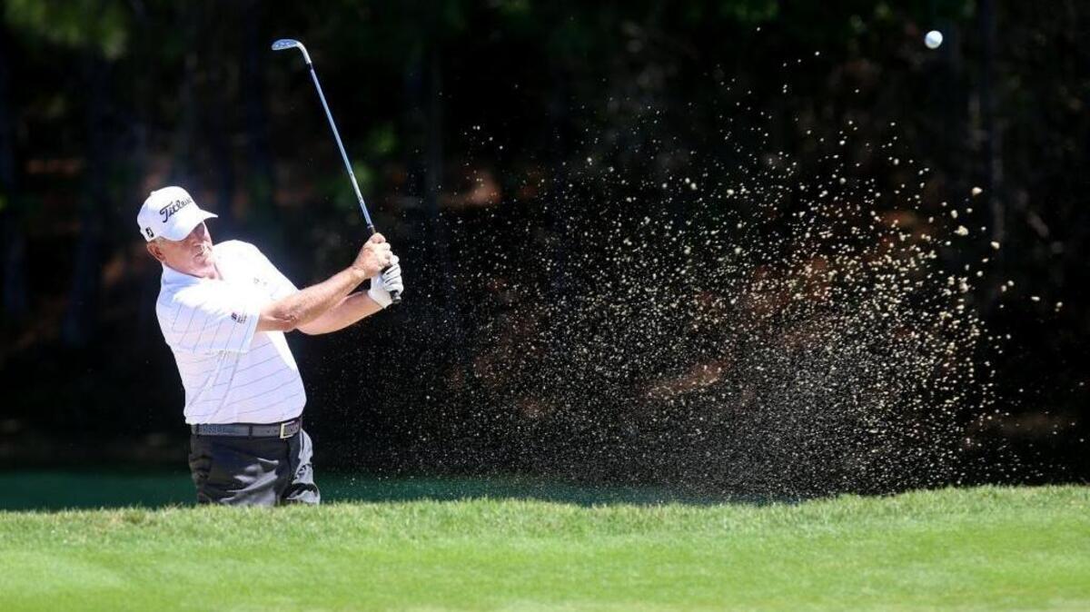Jay Haas hits his ball out of a sand trap on the first hole during the first round of the Mississippi Gulf Resort Classic on Friday at Fallen Oak.
