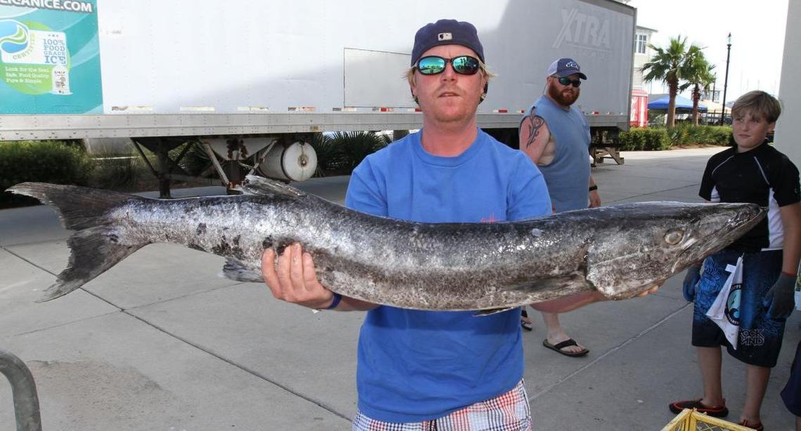 Mark Alan Ros of Pascagoula holds his 24-pound, 12-ounce barracuda at the Mississippi Deep Sea Fishing Rodeo at Barksdale Pavilion in Gulfport on Tuesday, July 4, 2017. The fish won first-place in it’s division.