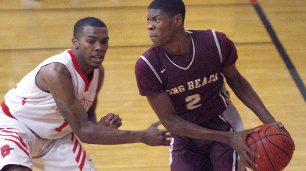 Monta Davis of Long Beach looks to advance the ball up court against Biloxi's Ahmad Arrington on Dec. 2, 2016.