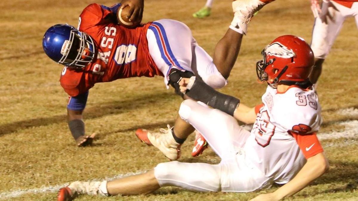 Florence linebacker Keegan Ward tackles Pass Christian running back Tionne Frost during the second quarter of their Class 4A playoff game at McDonald Stadium in Pass Christian on Friday, Nov. 3, 2017.