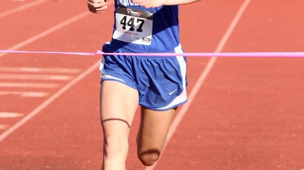 Vancleave’s Lina May crosses the finish line to win the girls Region 7-4A cross-country championship Saturday in Long Beach.