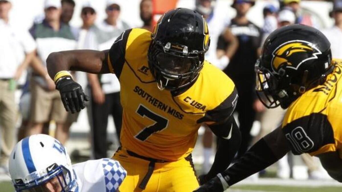 Southern Miss safeties Jomez Applewhite (7) and Tarvarius Moore (18) make a play on defense against Kentucky on Sept. 2 in Hattiesburg.
