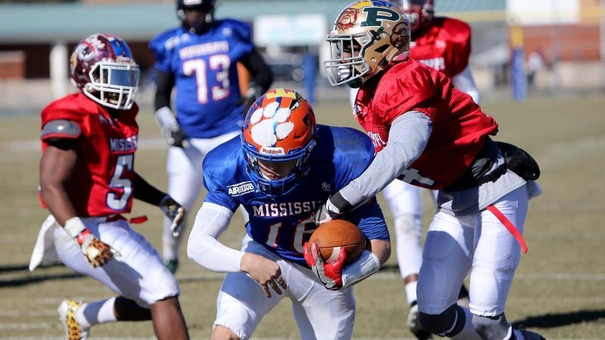 North Pontotoc quarterback Clark Mills breaks through Poplarville defensive back D.J. Travis for a touchdown during the Bernard Blackwell Classic on Saturday, December 9, 2017.