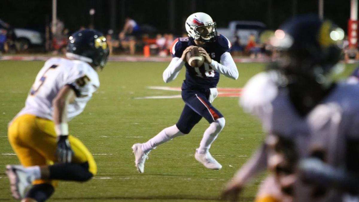 Hancock quarterback Caleb Garcia looks for a receiver during the second quarter of their game against Gautier at Brett Favre Field in Kiln on Friday, Sept. 1, 2017.