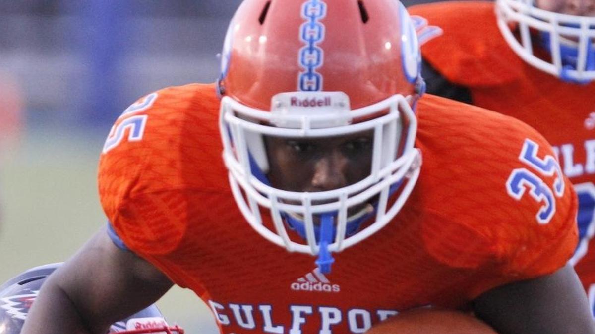 Gulfport running back Jordan Lee runs through a Hancock tackle during the first quarter of their game at Milner Stadium in Gulfport on Oct. 6.