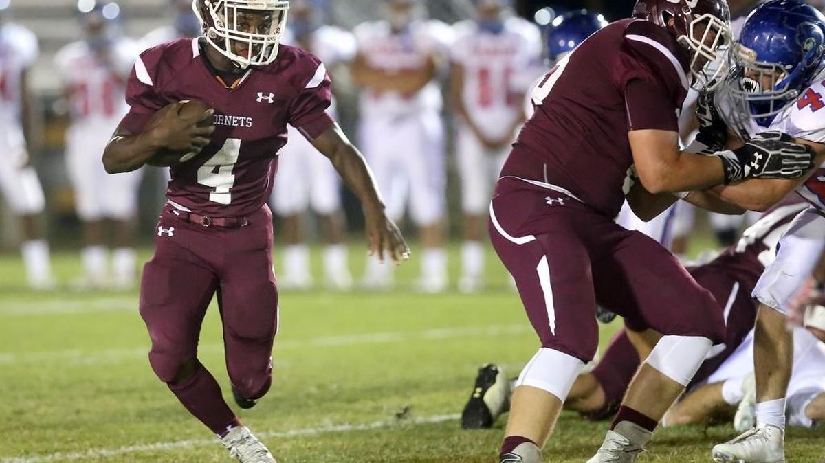 East Central junior Tony Brown runs the ball against Pass Christian on Friday, October 7, 2016.