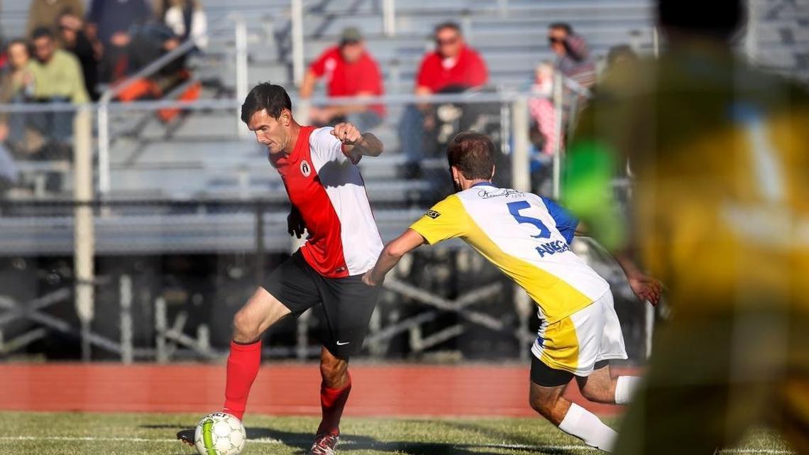 Biloxi City Futbol Club's Patrick Harrison angles around Shreveport Rafters' Hardy Hall while trying to get to the goal on Sunday, November 20, 2016, at Yankie Stadium.
