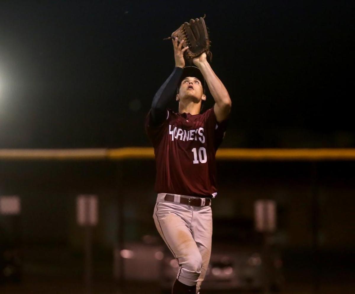 East Central right fielder Brad Cumbest makes a catch while competing against Long Beach on March 10, 2017, at Long Beach High.