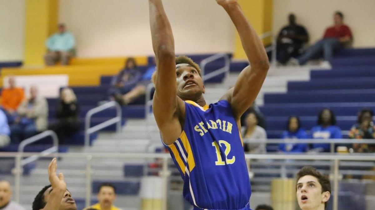 St. Martin's Daquan Gaudin puts up a shot against McGill Toolen during the fourth quarter of their Joe Barlow Thanksgiving Invitational basketball tournament game on Tuesday, Nov. 22, 1016.