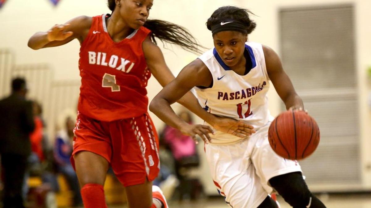 Pascagoula's Zion Morgan is guarded by Biloxi's Tytiana Brumfield as she dribbles the ball down the court on Tuesday, December 6, 2016. Pascagoula is currently on a nine-game winning streak.
