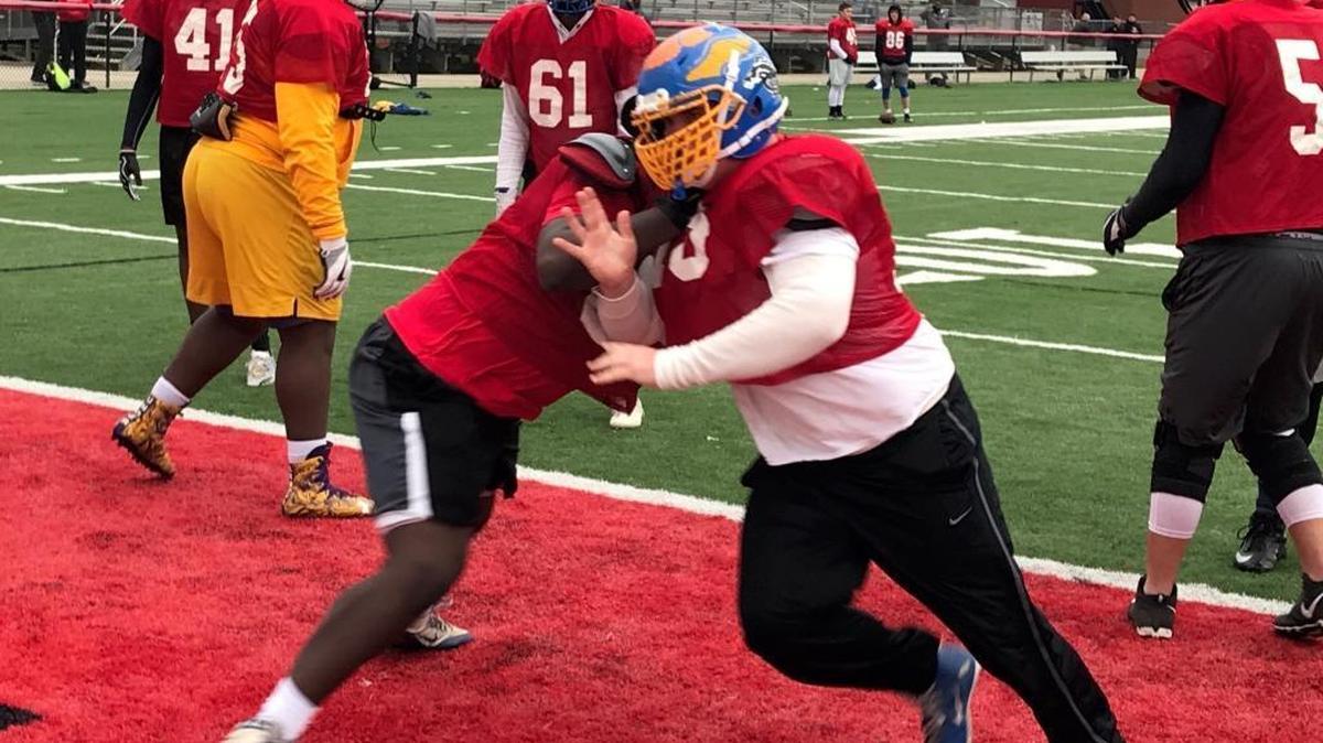 Resurrection lineman Jackson Byrd attempts to get past an offensive lineman during Bernard Blackwell All-Star Game practice Thursday at Harrison Central.