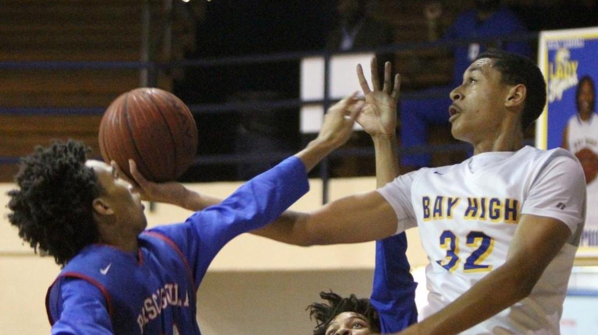 Bay's Galen Smith Jr. puts up a shot against Pascagoula's Jayden Mccorvey , left, and Noel Jones during the first quarter of their game at Bay High on Tuesday, Nov. 15, 2016. Bay has once again regained the top spot in the Sun Herald’s weekly prep poll.