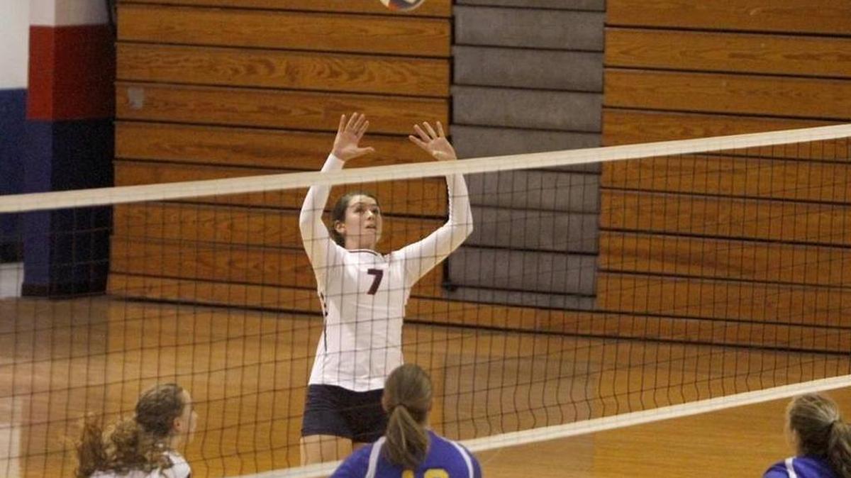 Hancock's Madison Ladner prepares to set up a shot over St. Martin's Sierra Lamey in a first-round state playoff game last week. The Lady Hawks meet Tupelo in the Class III state semifinals at 7 p.m. Friday at Millsaps College
