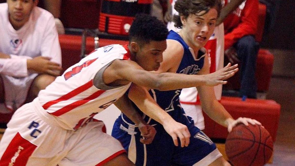 Vancleave guard Trevor Davis drives the baseline against Pass Christian's Raymond Obillo, Thursday, Feb. 18, 2016. Davis led Vancleave past St. Stanislaus in overtime on Tuesday.