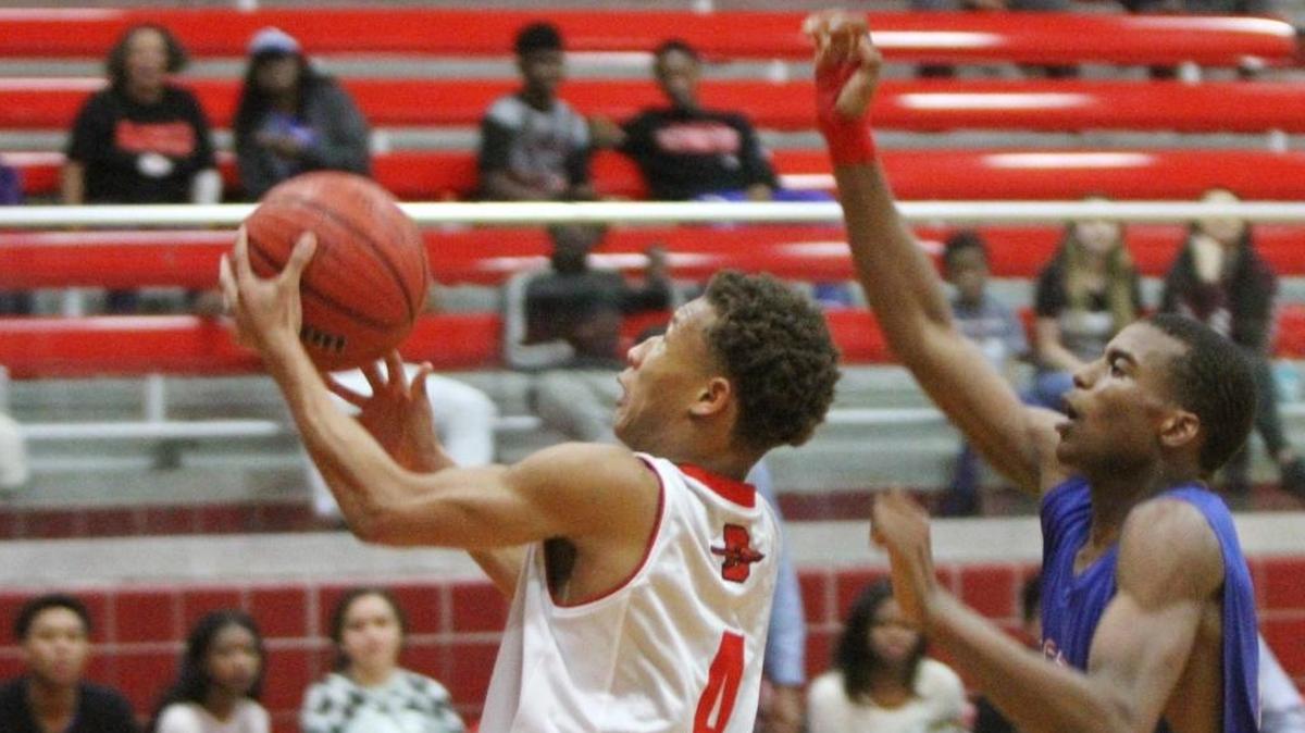 Biloxi's Dontavius Proby drives to the basket past Pass Christian's Aydarius Young during the first quarter of their game at Biloxi High School on Tuesday, Dec. 13, 2016. Proby helped Biloxi defeat West Harrison on Thursday.