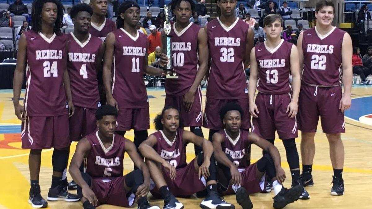 The George County basketball team poses with its Hoopsfest trophy after beating Gulfport Saturday at the Mississippi Coast Coliseum.