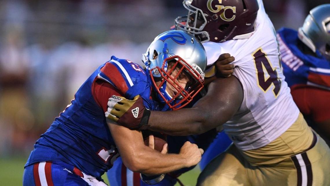 George County defensive lineman McKinnley Jackson (44) wraps up Pascagoula quarterback Hunter Collins (15) during the first quarter, Sept. 9, 2016, at Pascagoula High School in Pascagoula.