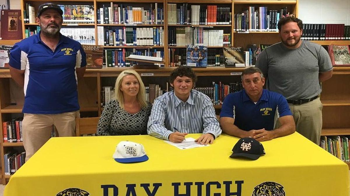Bay High baseball standout Gage Kiser, center, signed to play at Southwest Community College.