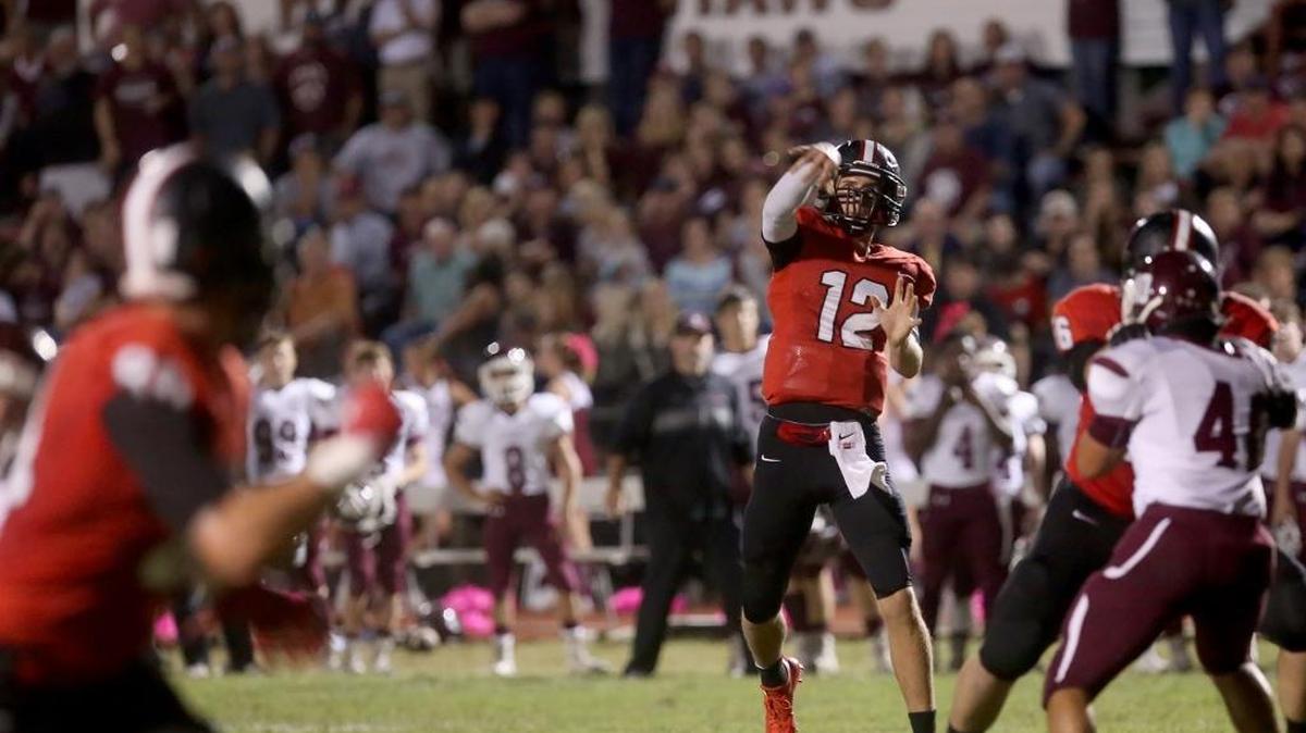 St. Stanislaus quarterback Myles Brennan throws a touchdown pass to Chase Rogers on Friday, October 14, 2016, in Bay St. Louis.