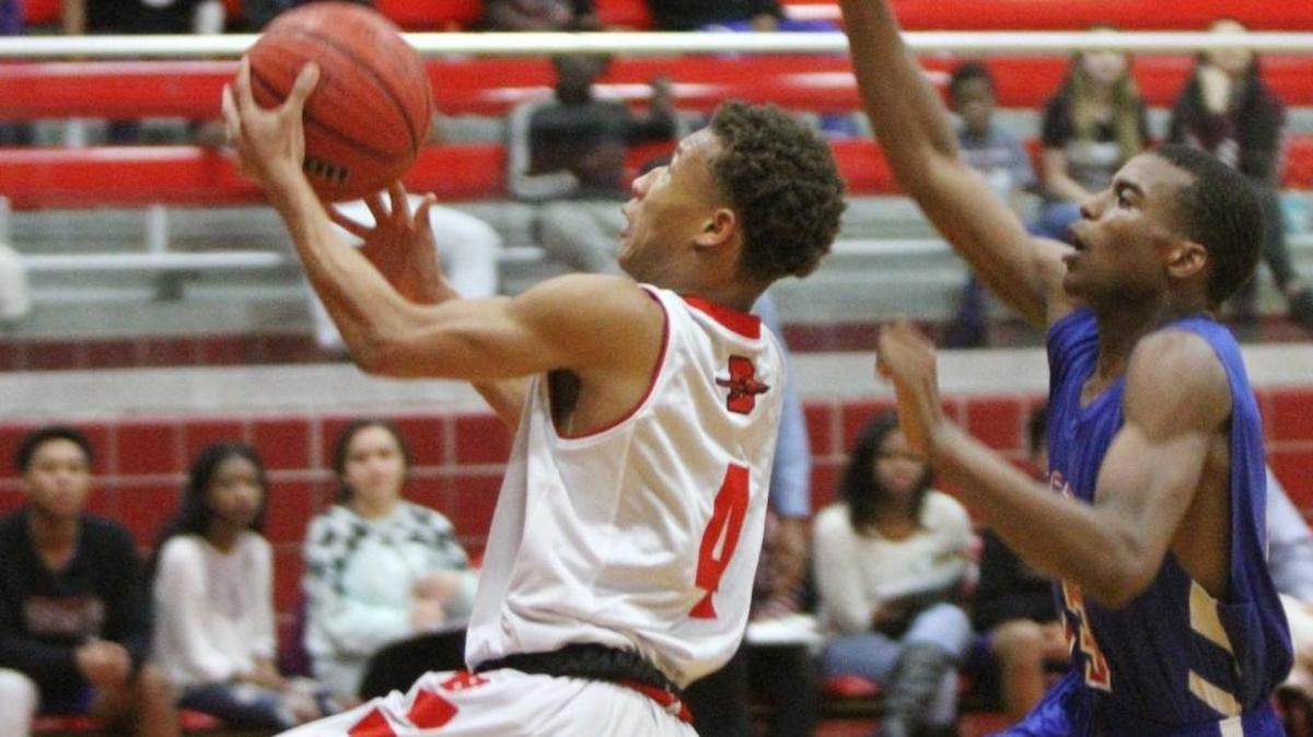 Biloxi's Dontavius Proby drives past Pass Christian's Aydarius Young on Dec. 13, 2016. Proby led the Indians to the Jackie Laird Tournament title on Saturday.
