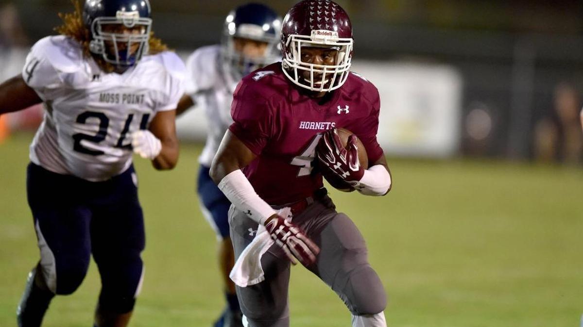 East Central running back Tony Brown (4) runs the ball against Moss Point outside linebacker Jalin Stallworth (24) in Hurley on Sept. 29.