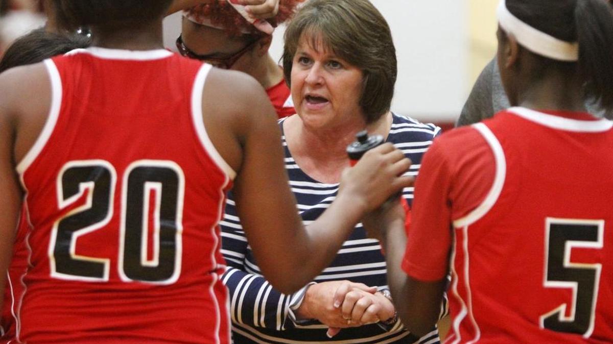 Harrison Central head coach Nancy Ladner talks to her players on Friday at Biloxi.