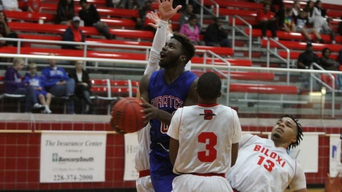 Pass Christian’s Tionne Frost drives to the basket at Biloxi on Dec. 13. Frost led PCHS past Harrison Central on Tuesday.