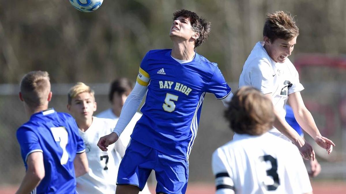 Bay High's Ethan Loftin (5) heads the ball for a goal against Florence on Saturday, February, 4, 2017, at the MHSAA Soccer Classic, Class 4A and 5A state championships, at Madison Central High School in Madison, Miss.