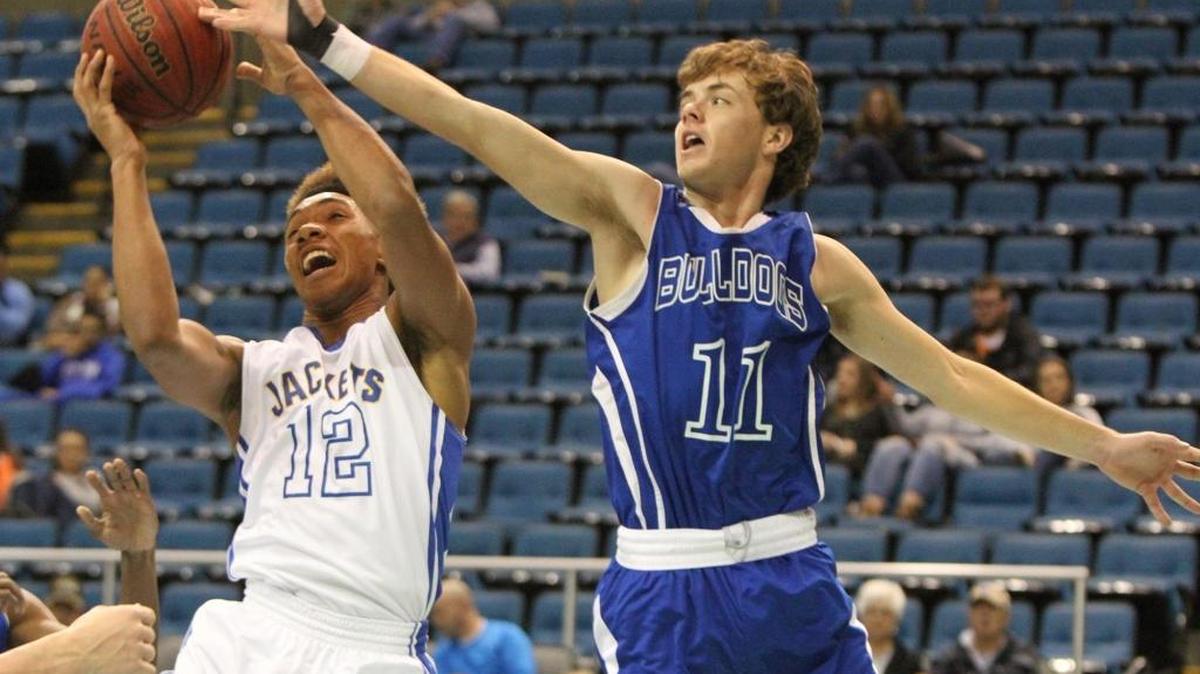 St. Martin's D.Q. Gaudin grabs a rebound against Vancleave's Trevor Davis during the first quarter of their Hoopsfest game at the Mississippi Coast Coliseum in Biloxi on Saturday Jan. 28, 2017.