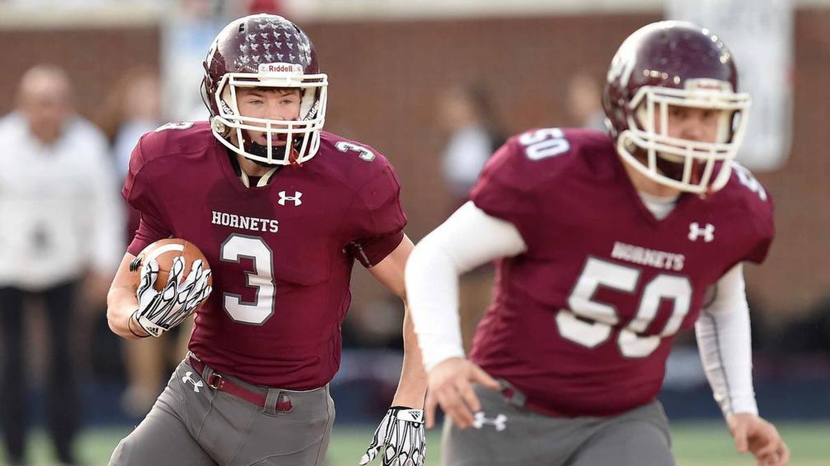 East Central’s Cameron Gray (3) runs behind guard Will Boone (50) against Noxubee County on Nov. 2 in Oxford.