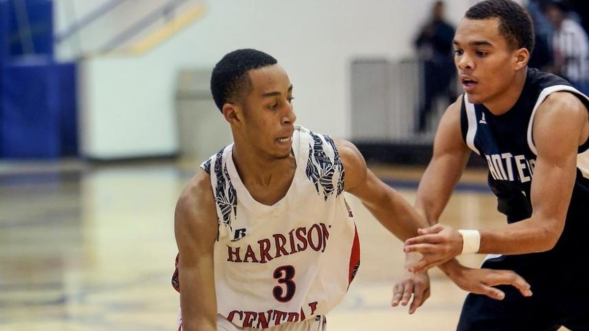 Harrison Central's Dajon Whitworth dribbles the ball while guarded by Pascagoula's Jonas Burley during the Adidas Holiday Classic final on Friday, December 29, 2017, at Gulfport High.