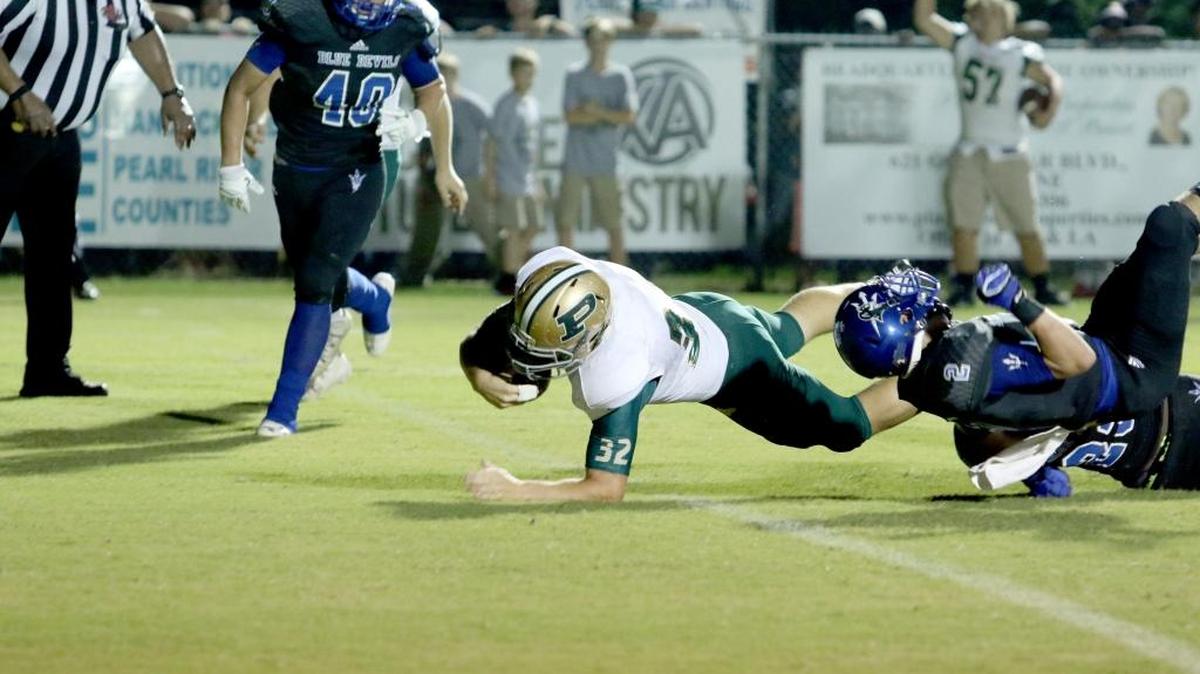 Poplarville’s Payton Grahan dives for a touchdown during the rivalry matchup against the Pearl River Central Blue Devils Friday night. The Hornets brought home a close win with a last-minute field goal.