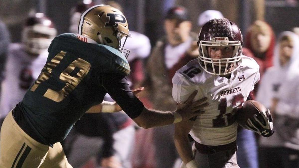 Poplarville's Demariano Henry chases East Central quarterback Jarret Goff during the second quarter of their 4A South State championship game at Poplarville on Nov. 24.