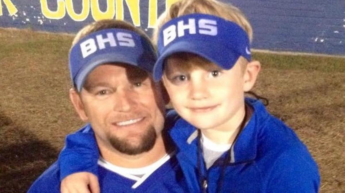 Former Bay High football coach Benji Foreman poses for a photo with his son, Jack.