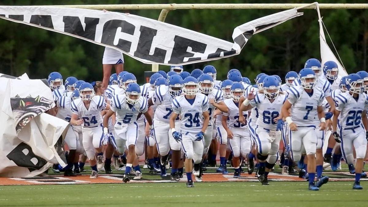The Vancleave High School football team makes their entrance onto the field while playing at West Harrison on August 25.