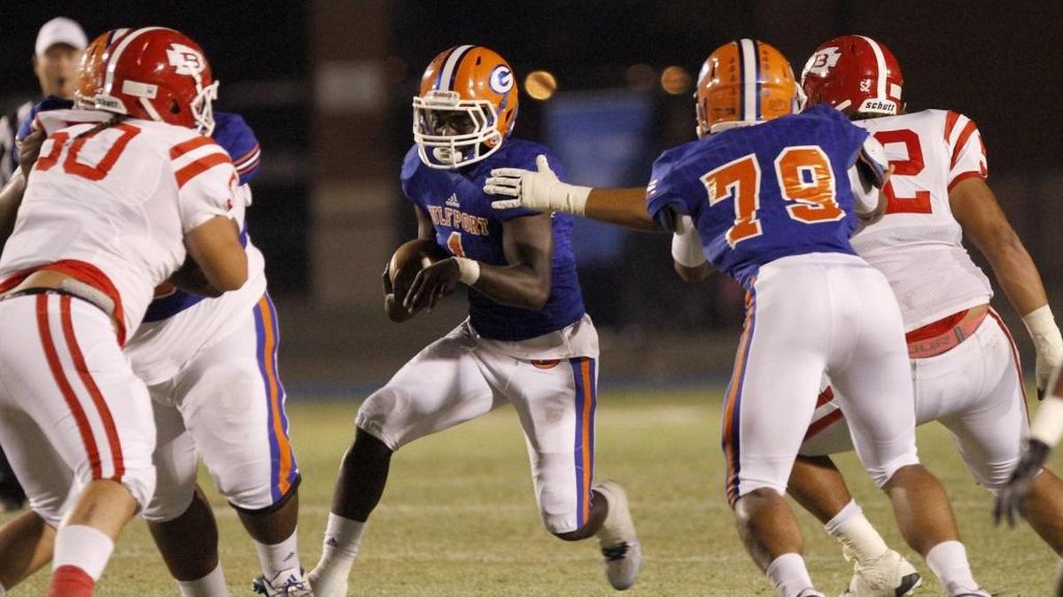 Gulfport quarterback Cleveland Ford tries to pick up a first down on a quarterback draw against Biloxi at Milner Stadium in Gulfport, Friday, Nov. 4, 2016.
