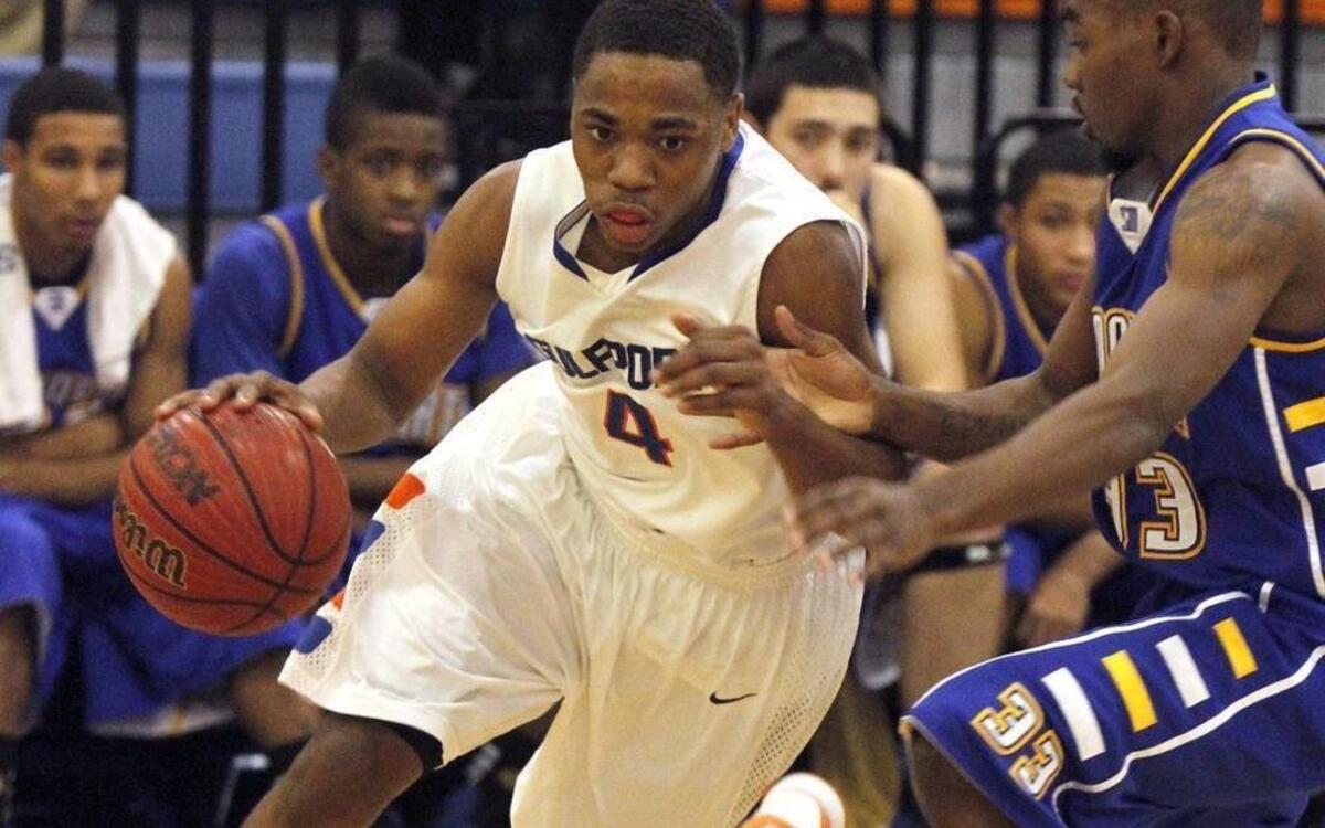 Jahshire Hardnett of Gulfport drives the baseline against Tre Dwellingham of St. Martin. Hardnett originally signed with Fordham but transferred to Chipola College last year. He recently signed with BYU.