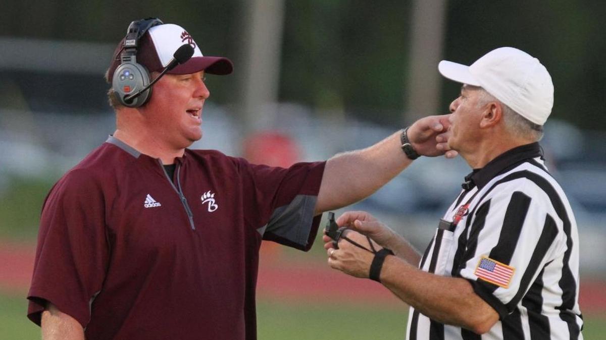 Long Beach head coach Forrest Williams talks to a referee during the second quarter of their game against Pass Christian on Thursday, Aug. 17, 2017. Long Beach announced Monday that Williams has been removed as athletic director and football coach but will remain with the district as assistant principal at LBHS.