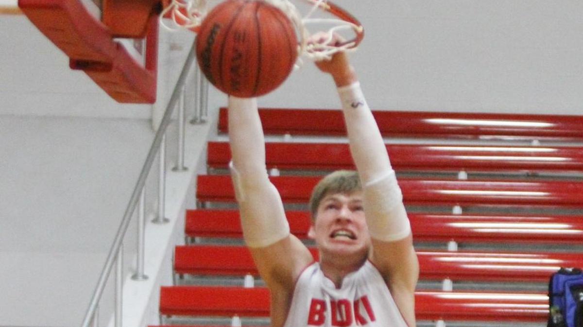 Biloxi 's Mike Burbridge dunks the ball against Pass Christian during the first quarter of their game at Biloxi High School on Tuesday, Dec. 13, 2016.
