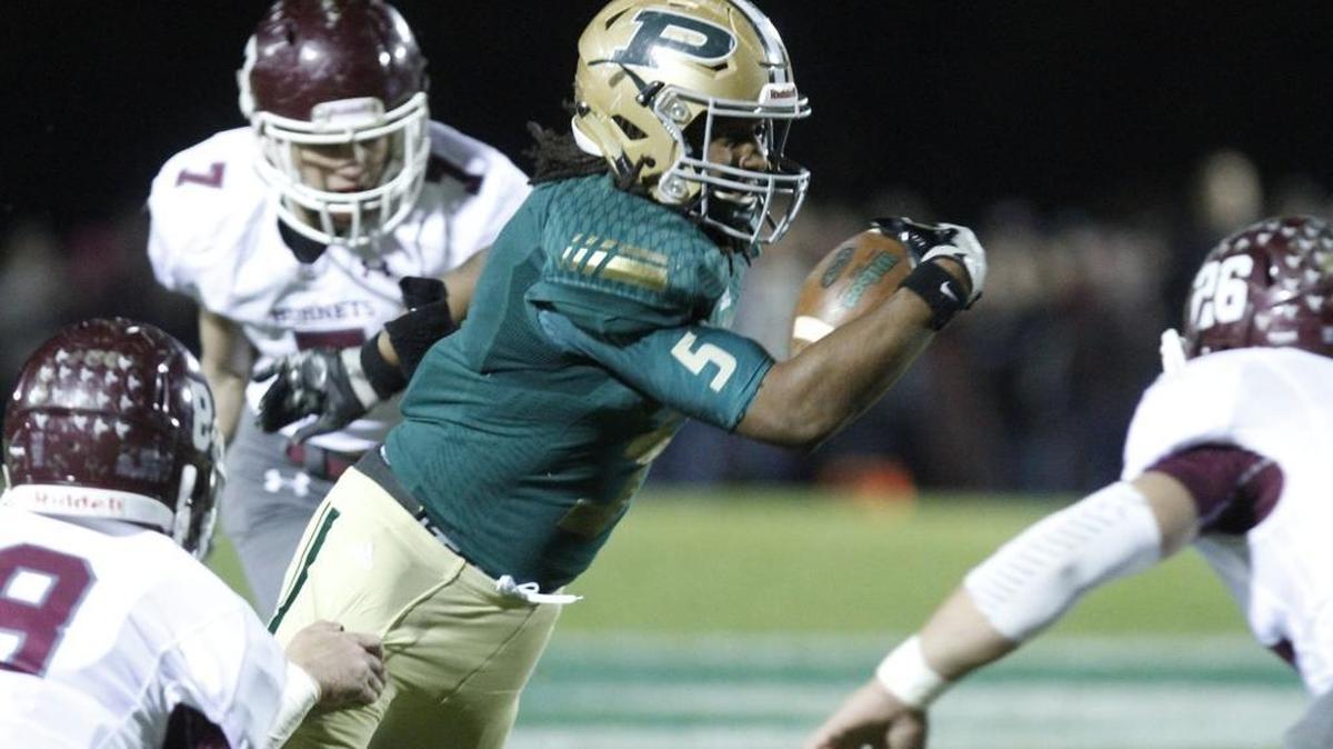 Poplarville running back Austin Bolton carries the ball against East Central during the first quarter of their 4A South State championship game at Poplarville High School Stadium on Friday, Nov. 24, 2017.
