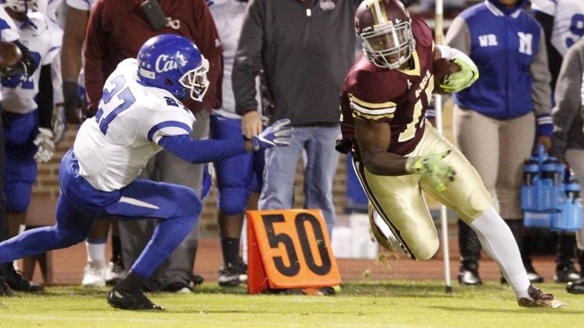 George County receiver Dwan Williams tries for a first down against Meridian's Aceon Hopkins in a 6A playoff game in Lucedale on Nov. 11.