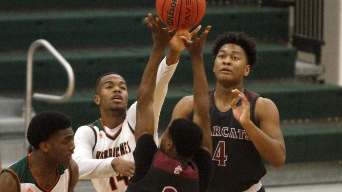 William Roberts of West Harrison blocks a pass attempt by Monta Davis of Long Beach, Tuesday, Feb. 14, 2017.