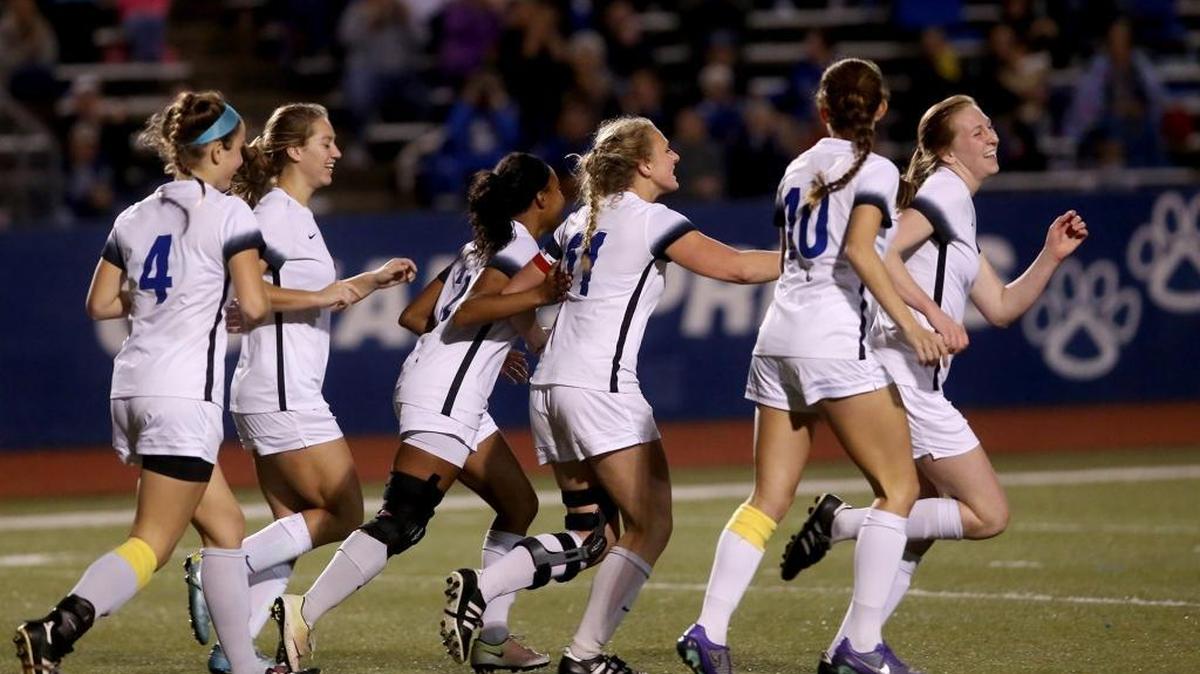 Ocean Springs celebrates a goal by Kayley Fountain, right, during the 6A playoffs against Biloxi on Tuesday in Ocean Springs.