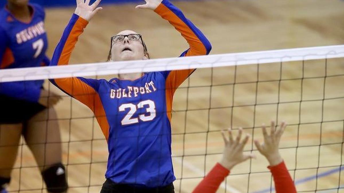 Gulfport's Jayden Bishop sets the ball while across the net from Biloxi's Quiava Lampley on Tuesday at Gulfport.