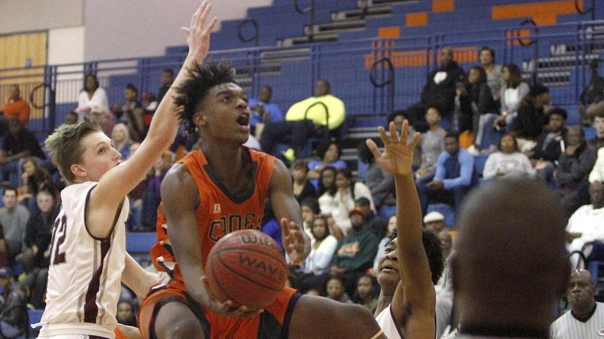 Drelon Pittman of West Harrison takes a scoop shot against Long Beach during the Gulfport Hardwood Holiday Classic, Thursday, Dec. 29, 2016. Pittman had a double-double as WHHS beat Hancock on Tuesday.