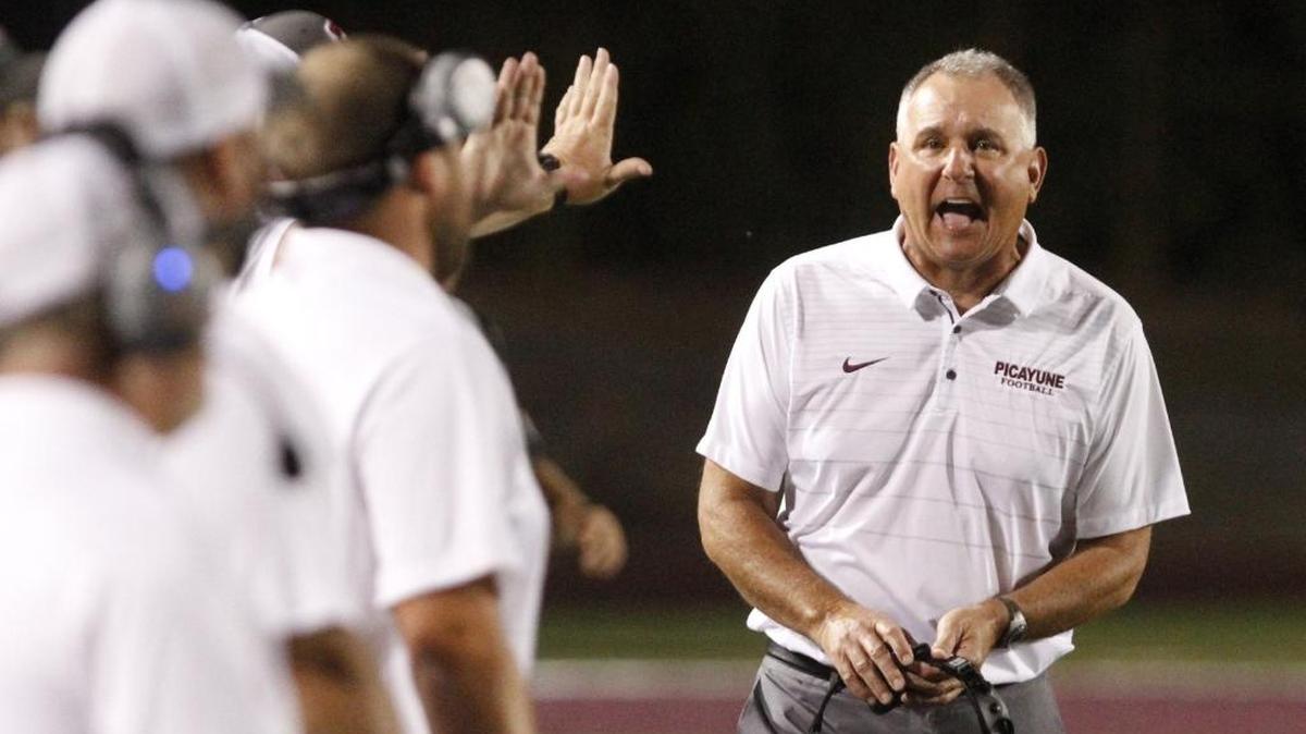 Picayune head football coach Dodd Lee talks to his staff during the first quarter of their game against Hattiesburg at Lee-Triplett Stadium in Picayune on Friday, Oct. 20, 2017.
