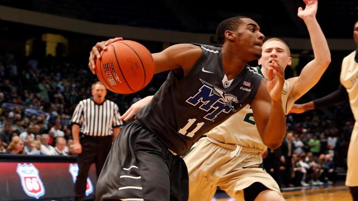 Middle Tennessee guard Edward Simpson Jr. (11) drives the baseline around UAB guard Nick Norton (2) during the Conference USA tournament championship on March 14, 2015, in Birmingham, Ala.