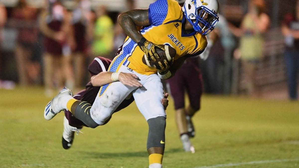 St. Martin's Kalem Reddix (2) scores a touchdown against East Central defensive back Glenn Evans (5) during the second quarter, Friday, Sept. 16, 2016, at East Central High School in Hurley.