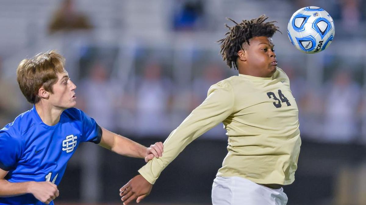 Northwest Rankin's Alphonso Bouldin (34) controls a ball against Ocean Springs' (14) Christopher Pasvantis during the 2017 6A Boys MHSAA Soccer Championships held at Clinton High School, Saturday February 4, 2017. 
